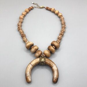 Artisan bone and wood bead statement boho festival necklace horn shape pendant.